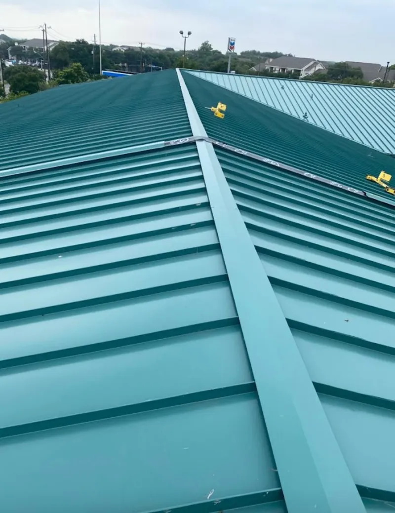 Green commercial metal roof ridge and valley for Metal Roof Repair in Estelle